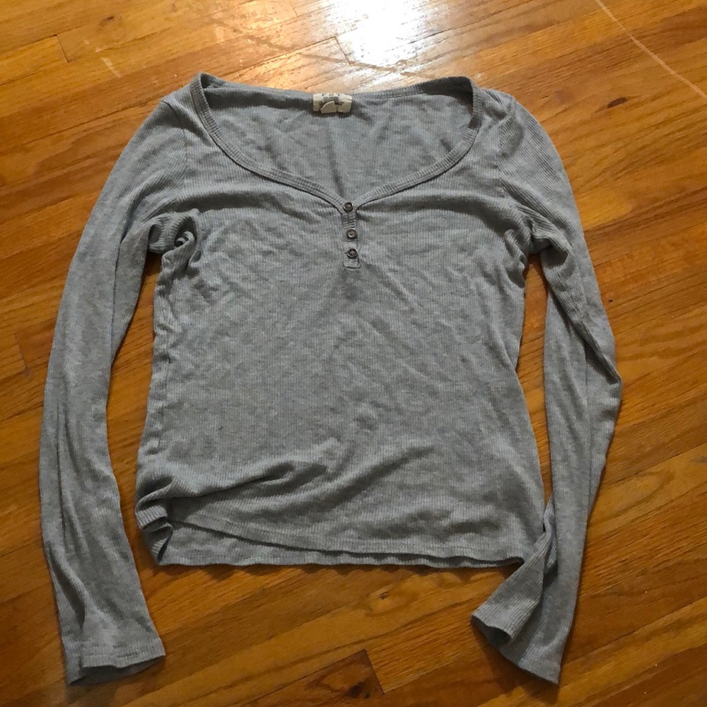 Tight fitting gray long sleeved shirt